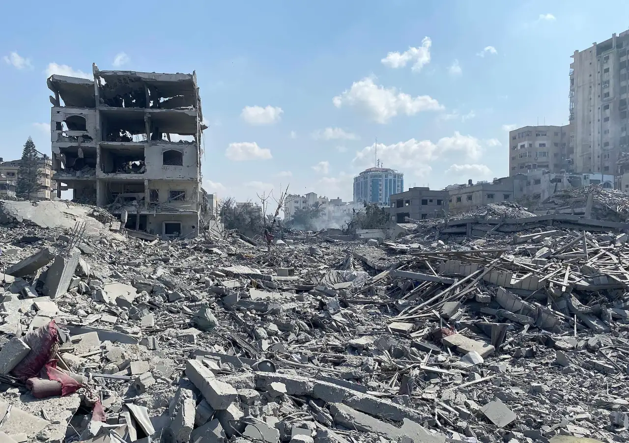 Damage to residential buildings in the Rimal neighborhood of Gaza City, caused by an Israeli airstrike on October 9, 2023.
