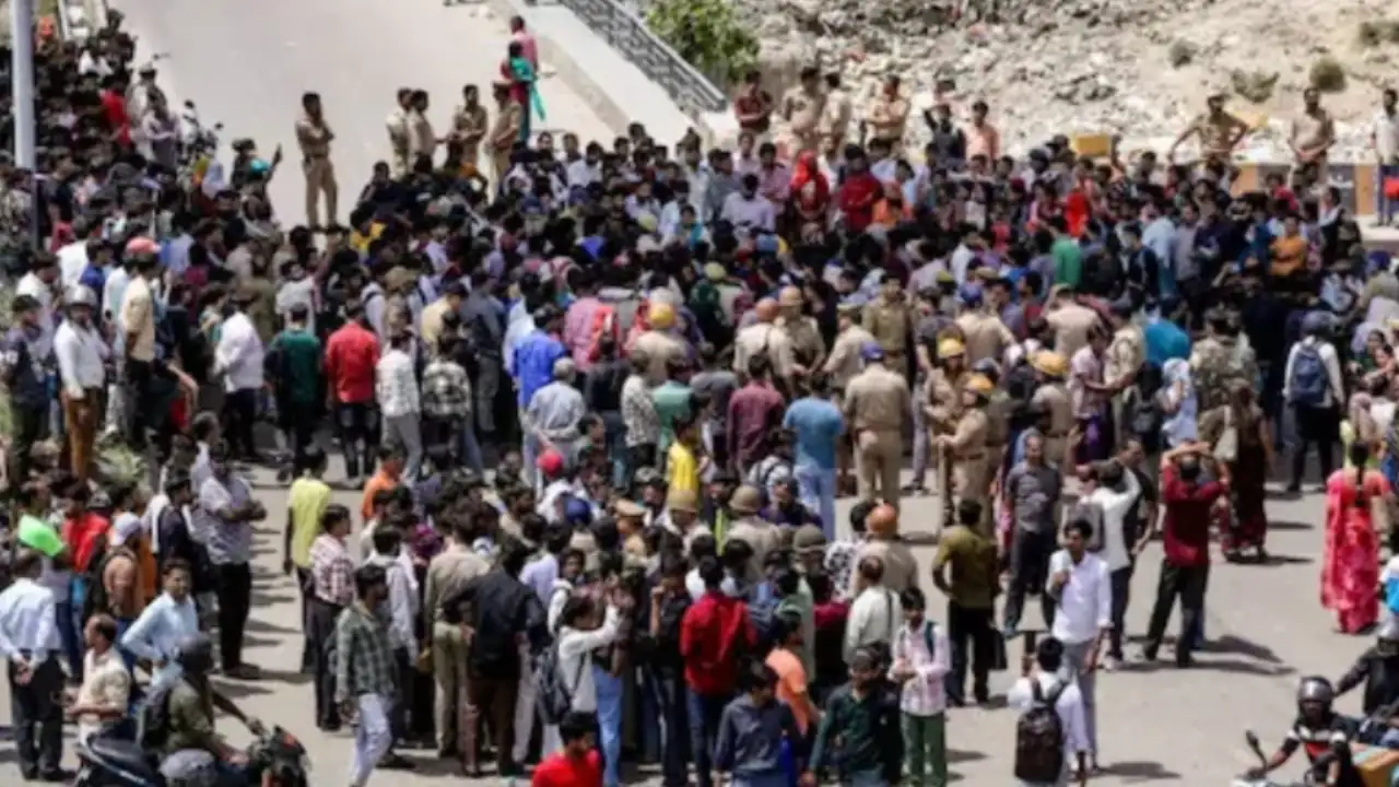 Garment company workers at the Hosiery Complex block the road as they stage a protest demanding a hike in their salary and other various issues in Noida.